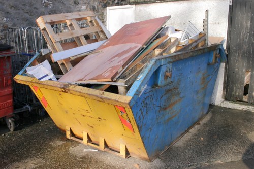 Professional loft clearance team at work in a Raynes Park home