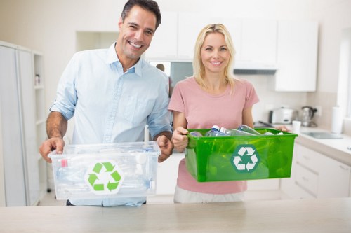 Waste collection trucks operating in Raynes Park